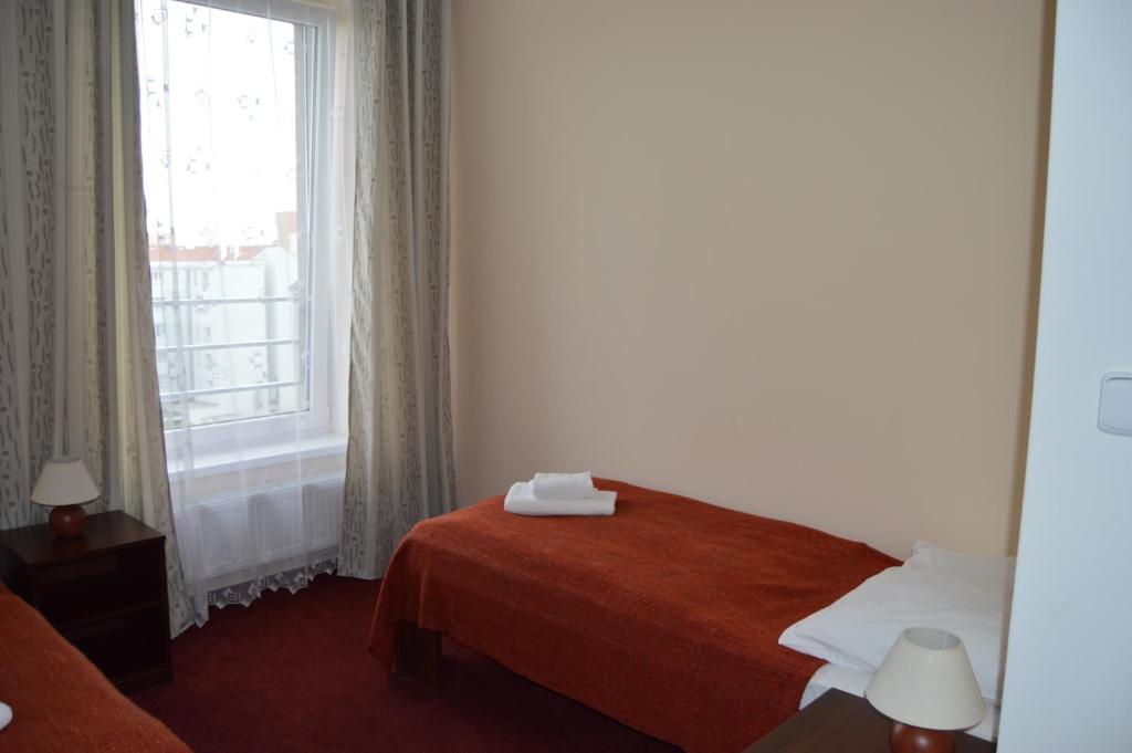 Postel nebo postele na pokoji v ubytování HOTEL ARÉNA