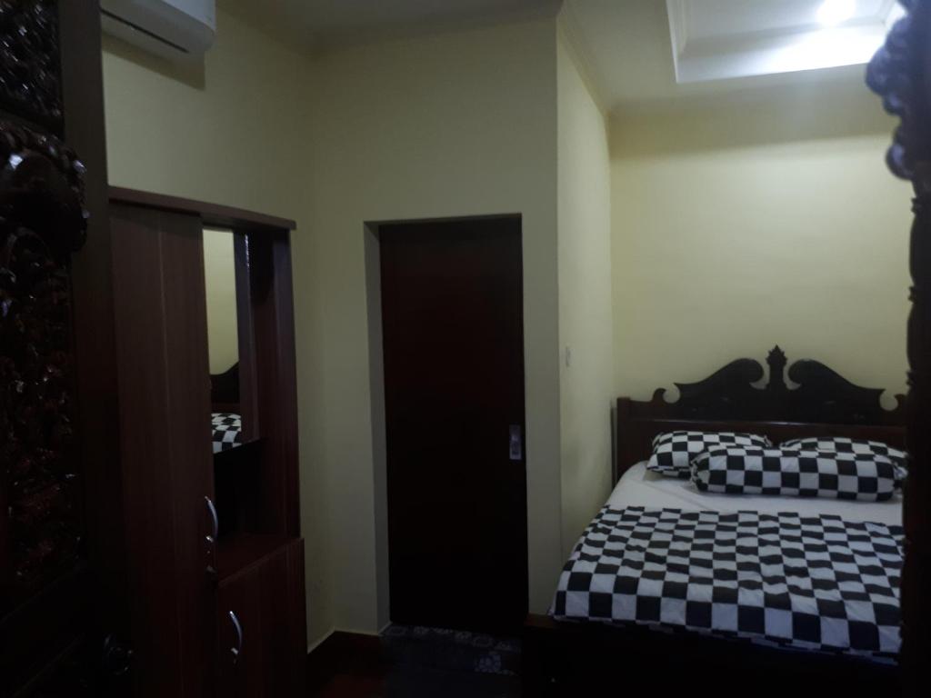 Postel nebo postele na pokoji v ubytování Indy House