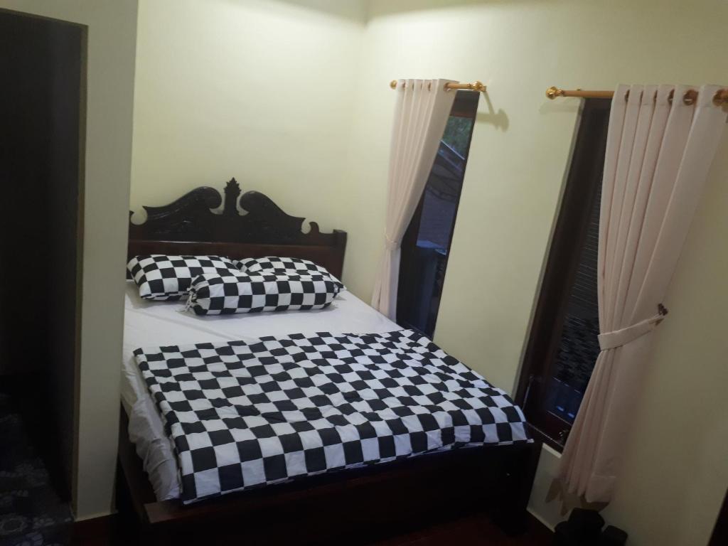Postel nebo postele na pokoji v ubytování Indy House