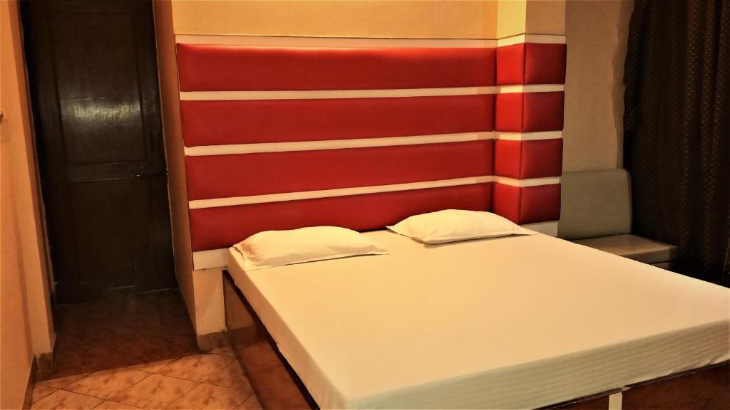 Postel nebo postele na pokoji v ubytování Hotel Kwality