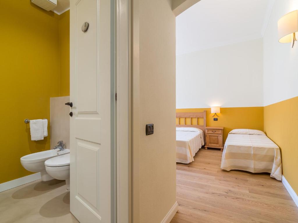 Postel nebo postele na pokoji v ubytování Charming Rooms Opuntia