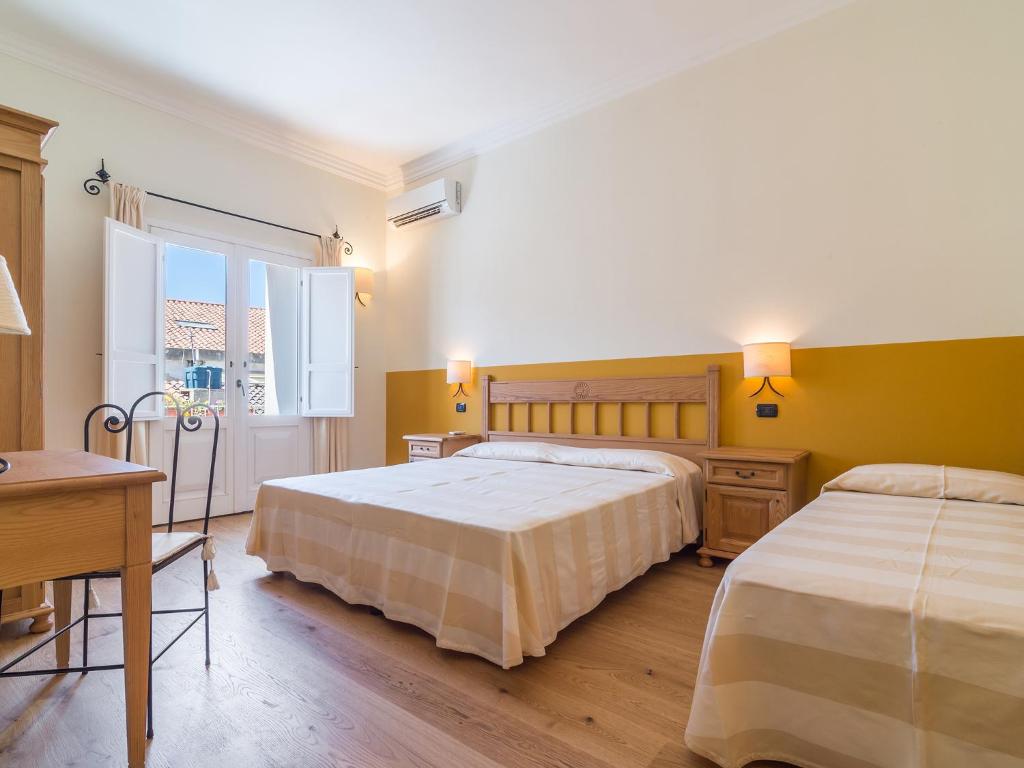 Postel nebo postele na pokoji v ubytování Charming Rooms Opuntia