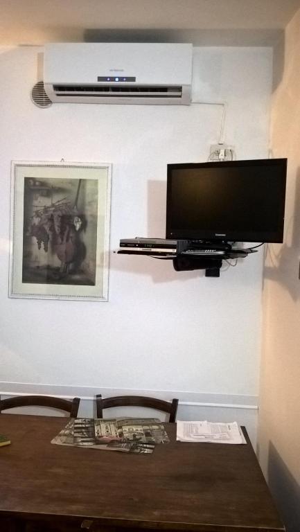 TV a/nebo společenská místnost v ubytování La Torre Nomipesciolini