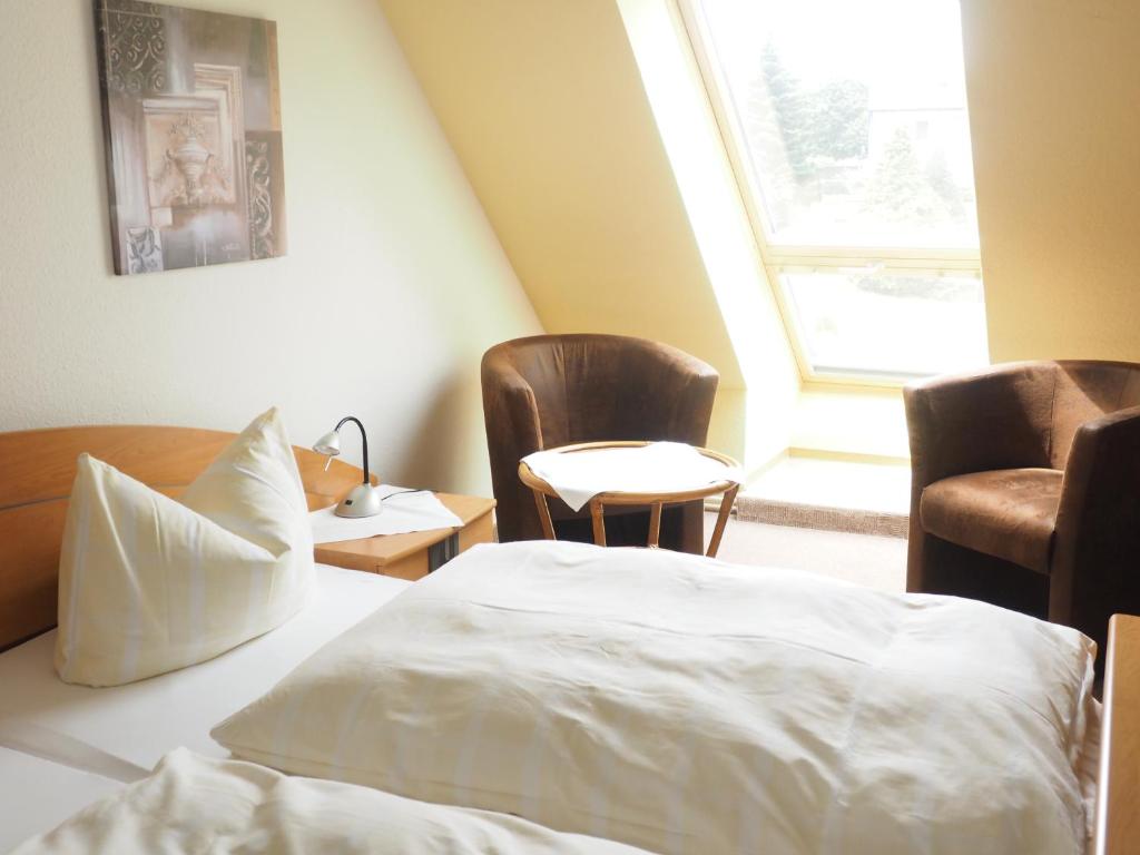 Postel nebo postele na pokoji v ubytování Hotel Cafe Bothe