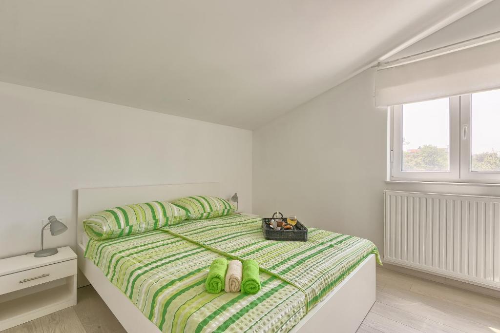 Postel nebo postele na pokoji v ubytování Holiday Home Nikol