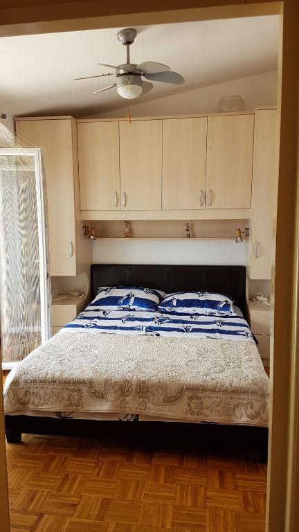Postel nebo postele na pokoji v ubytování Apartments Brčić