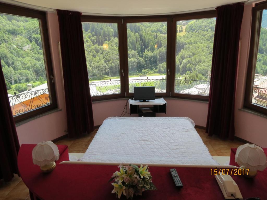 Postel nebo postele na pokoji v ubytování Hotel Mirage