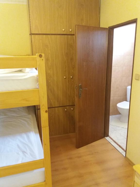 Postel nebo postele na pokoji v ubytování Retro Vrbovec