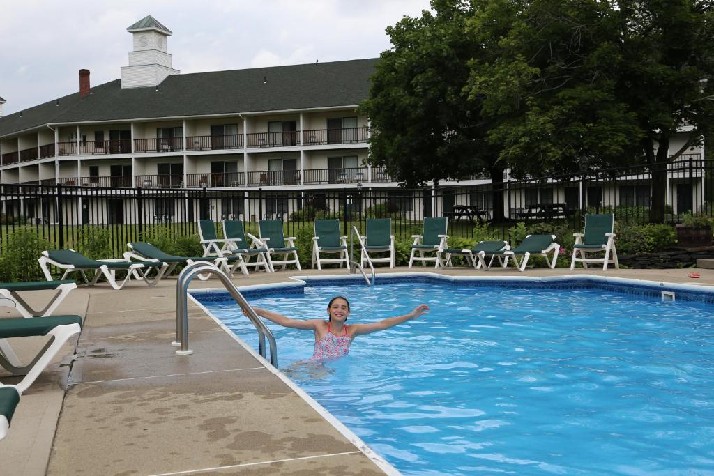 a woman in a swimming pool at a hotel at Fairbanks Inn in St. Johnsbury