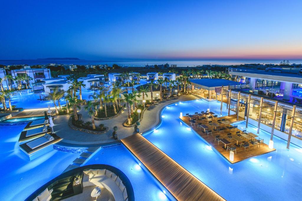 an aerial view of a resort at night at Stella Island Luxury Resort & Spa (Adults Only) in Hersonissos