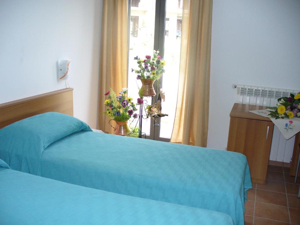 Postel nebo postele na pokoji v ubytování B&B La Collina