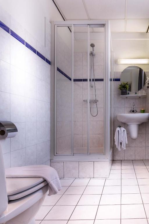 Koupelna v ubytování Hotel Riche