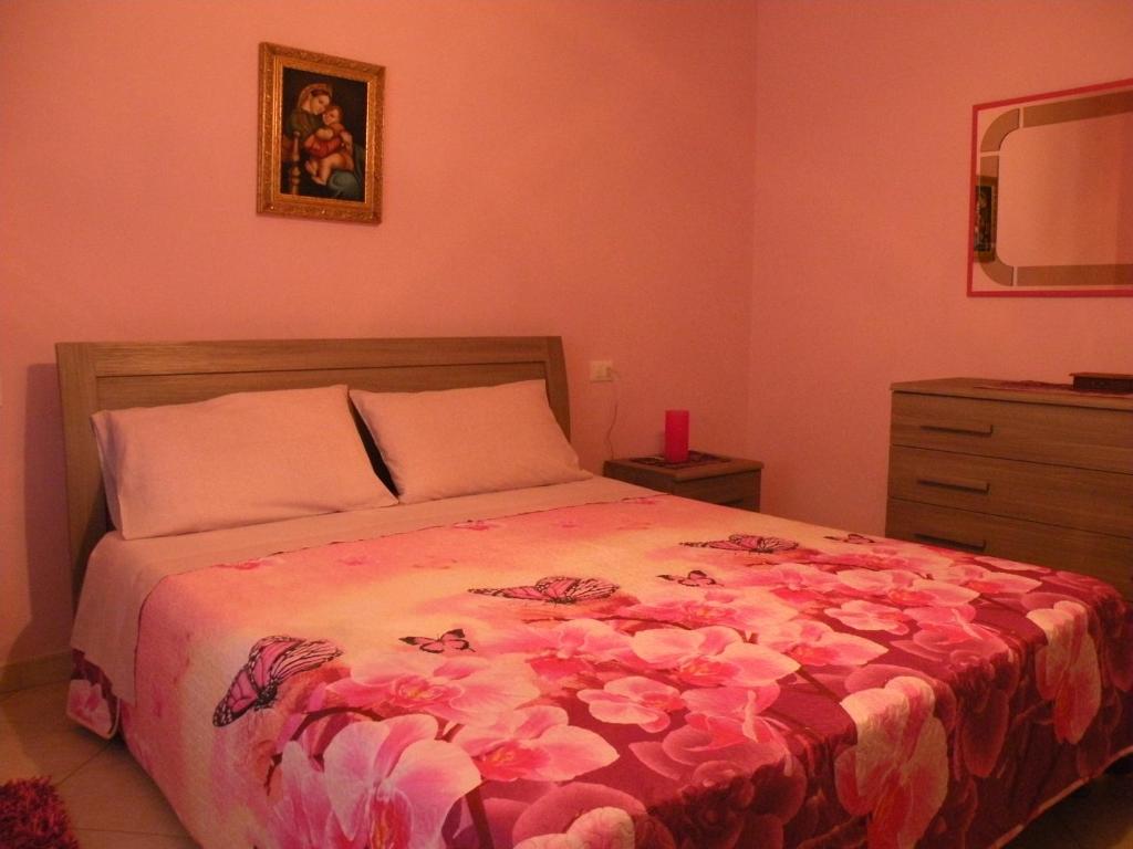 Postel nebo postele na pokoji v ubytování Casa Oriana