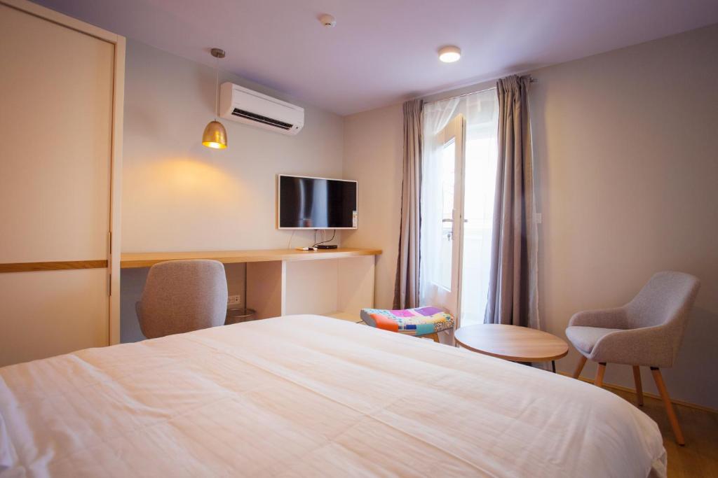 Postel nebo postele na pokoji v ubytování Mijama suites