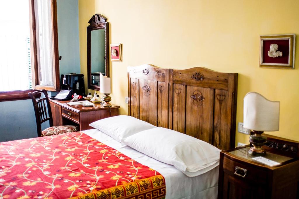 Łóżko lub łóżka w pokoju w obiekcie Hotel Il Bargellino