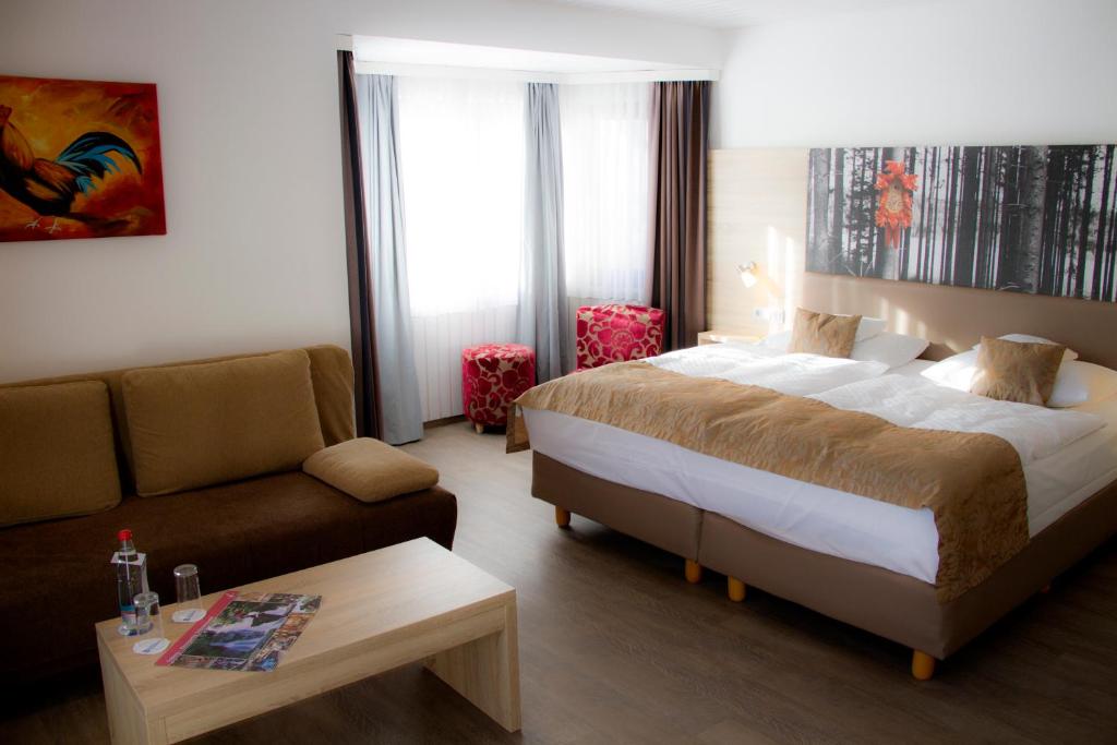 Postel nebo postele na pokoji v ubytování Best Western Plus Schwarzwald Residenz