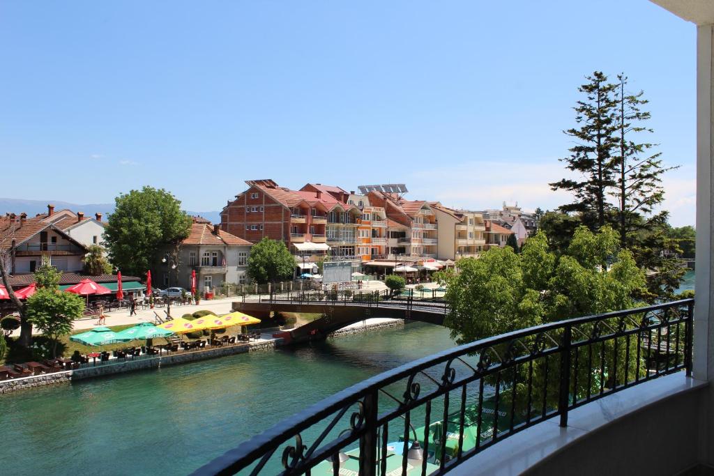 a bridge over a river in a city with buildings at Villa Nestor in Struga