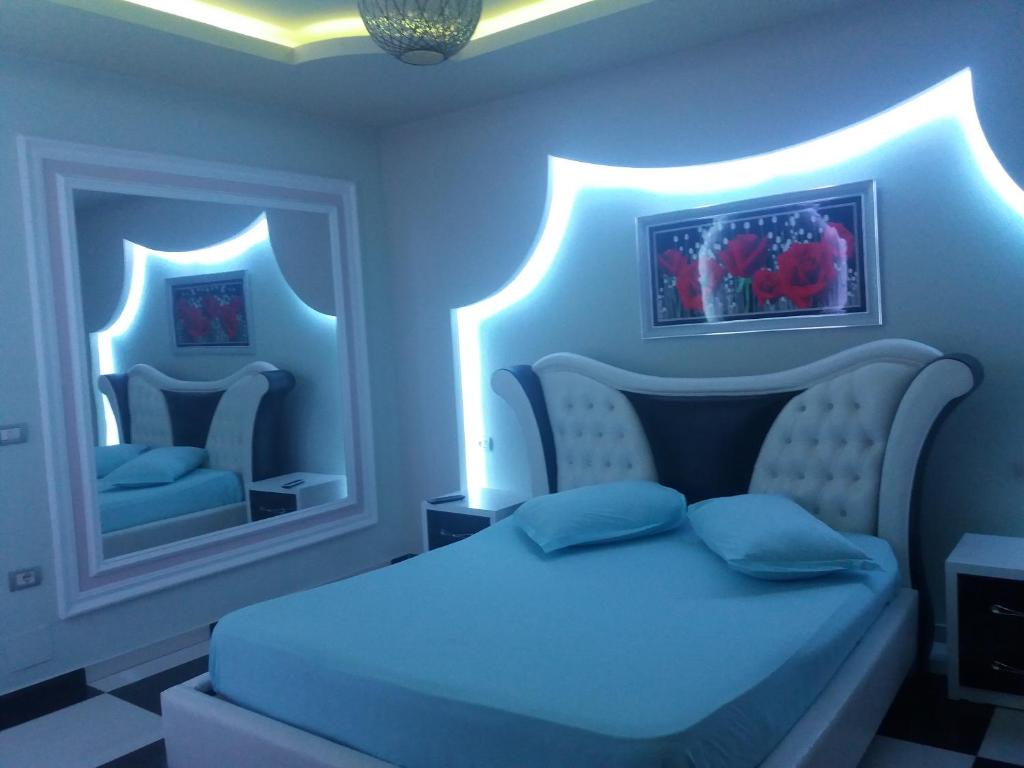 Postel nebo postele na pokoji v ubytování Hotel Buza