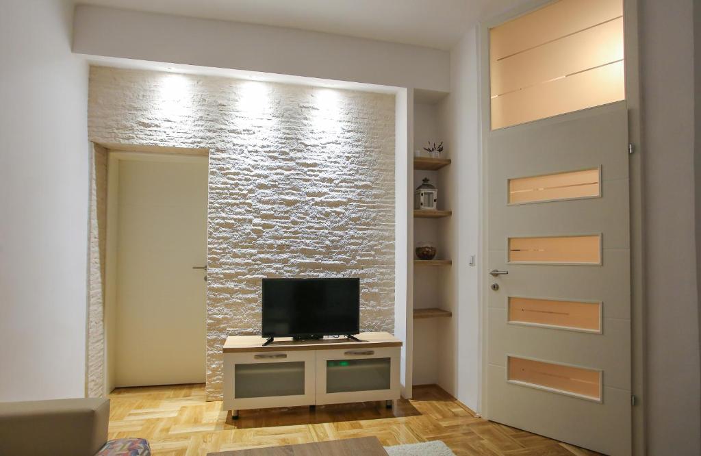 TV i/ili multimedijalni sistem u objektu Apartment Salsa