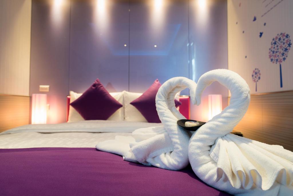 Postel nebo postele na pokoji v ubytování Kenting 157 Boutique Hotel