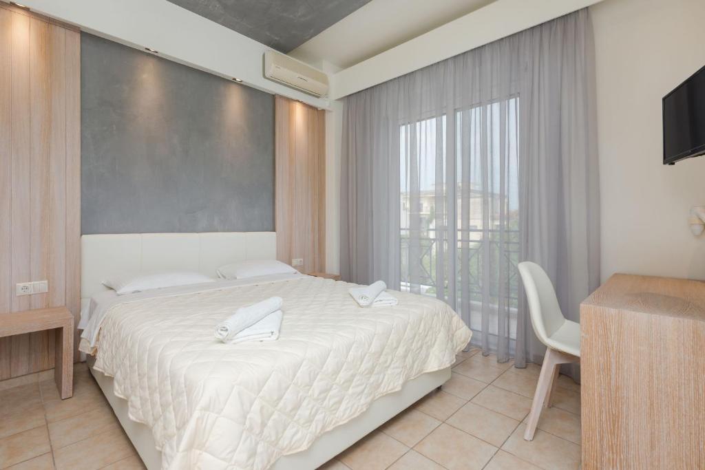 Postel nebo postele na pokoji v ubytování Hotel George