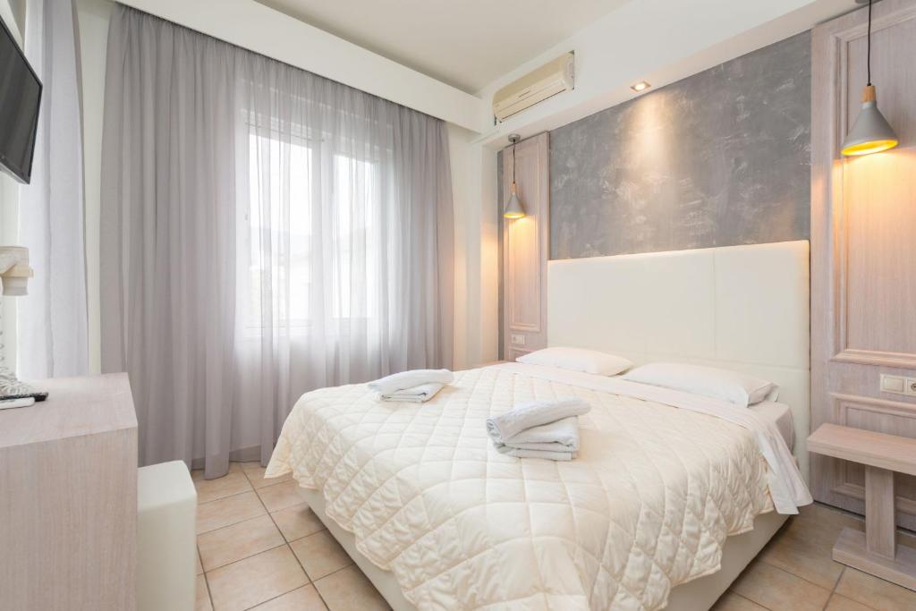 Postel nebo postele na pokoji v ubytování Hotel George
