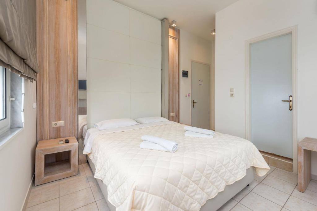 Postel nebo postele na pokoji v ubytování Hotel George