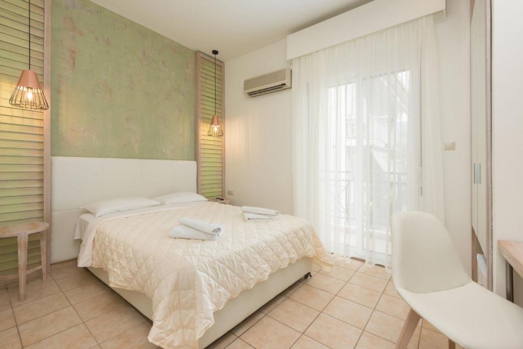 Postel nebo postele na pokoji v ubytování Hotel George