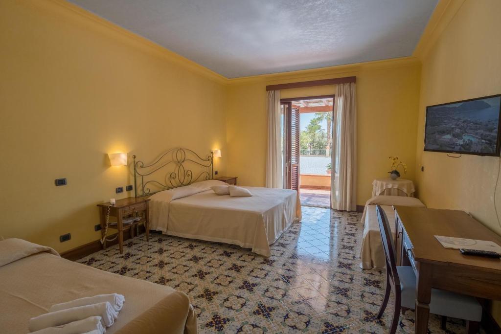 Postel nebo postele na pokoji v ubytování Hotel Aktea