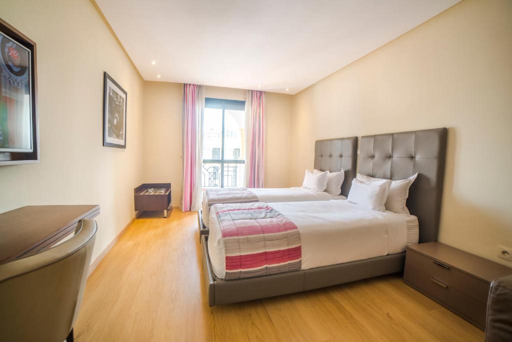 Letto o letti in una camera di Le Rio Appart-Hotel City Center
