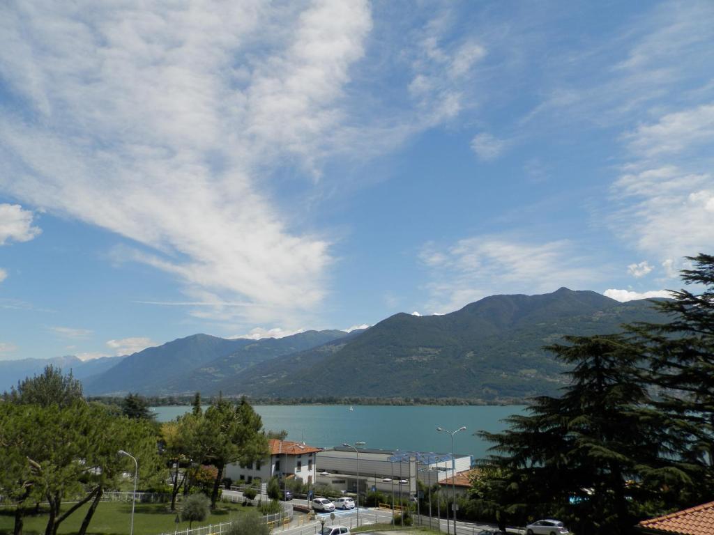 a view of a large body of water with mountains at Continental Hotel in Lovere