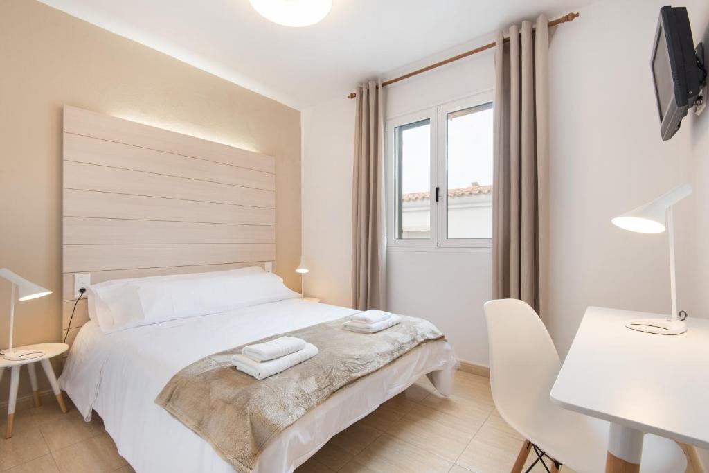 Postel nebo postele na pokoji v ubytování Hostal Jume - Urban Rooms