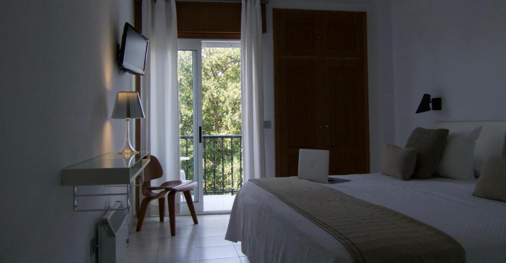 Кровать или кровати в номере Hotel Farsund