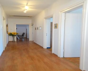 an empty hallway of an apartment with a hard wood floor at Apartment Dvorska in Crikvenica