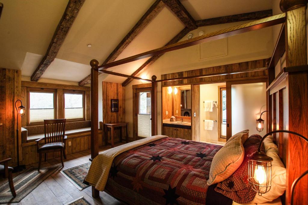 a bedroom with a large bed in a room at The Squibb Houses in Cambria