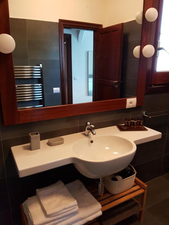 a bathroom with a sink and a mirror at Villa Crawford in San Nicola Arcella