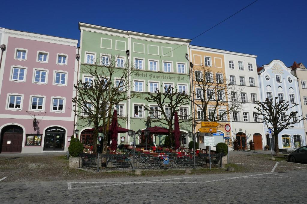 a group of tall buildings in a city at Bayerischer Hof in Burghausen