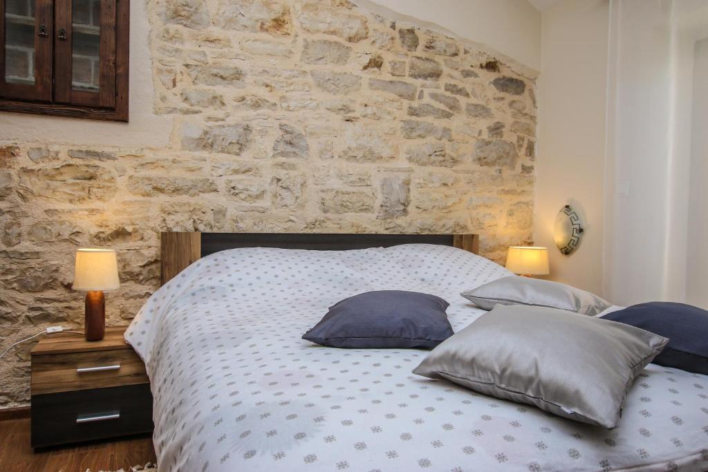 Postel nebo postele na pokoji v ubytování Apartman Ajhner
