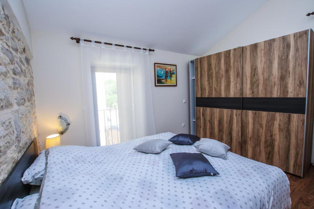 Postel nebo postele na pokoji v ubytování Apartman Ajhner