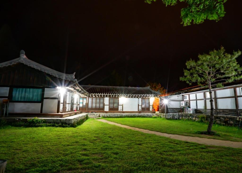 a night view of a building at night at Guesthouse Nabiya in Chuncheon