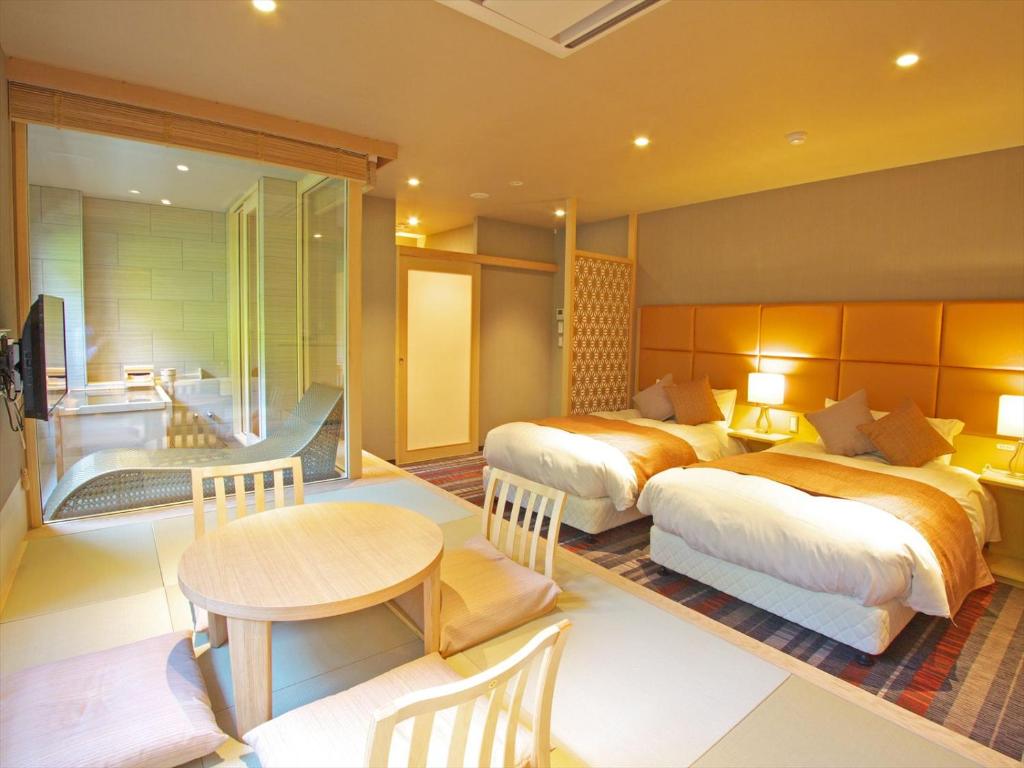 Postel nebo postele na pokoji v ubytování Hakone Yuyado Zen