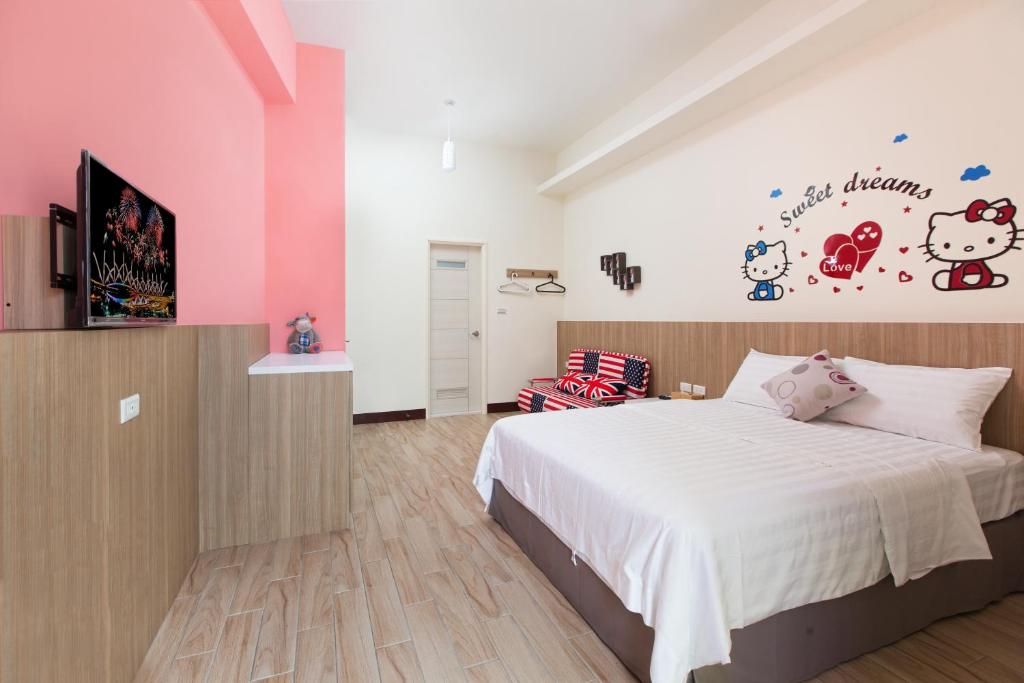 Postel nebo postele na pokoji v ubytování Sanwu Homestay
