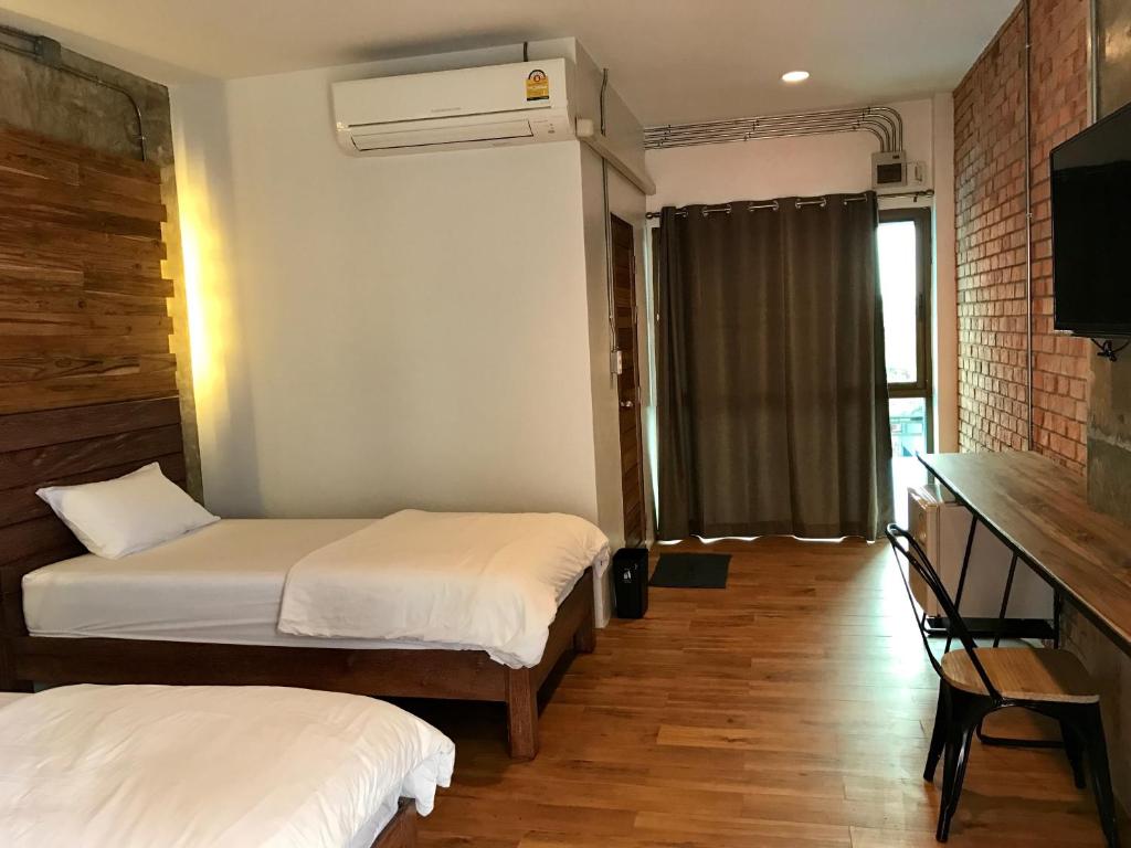 Postel nebo postele na pokoji v ubytování De Nan Hotel