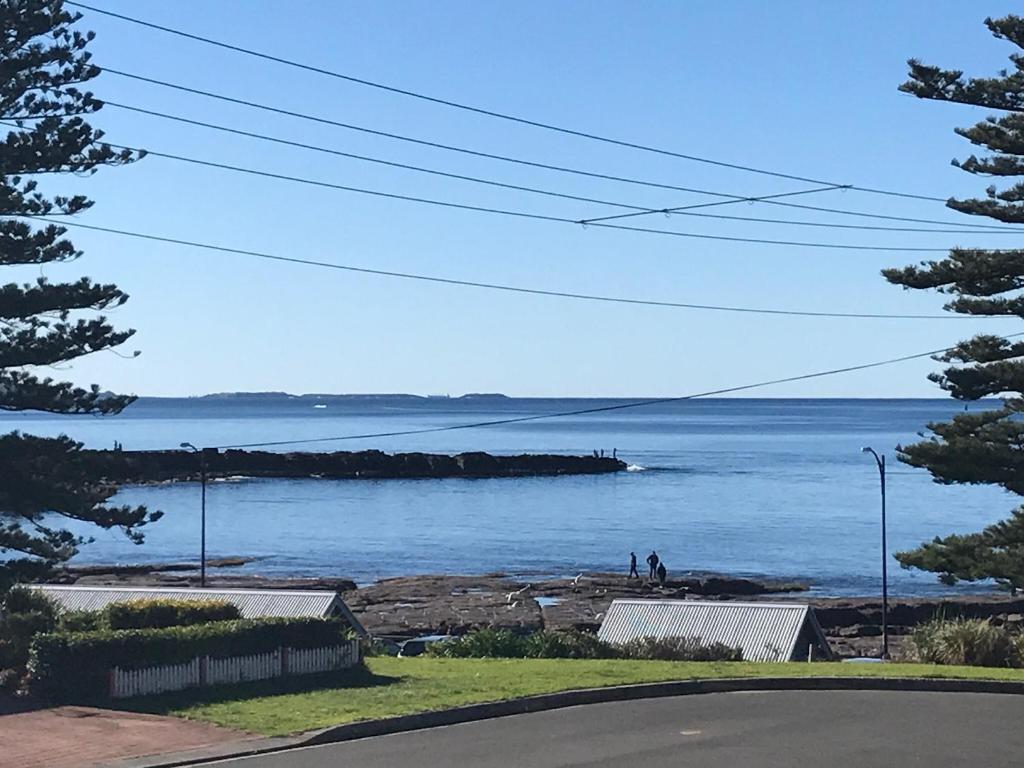 a view of a body of water from a road at Pelicans Rest Shellharbour in Shellharbour