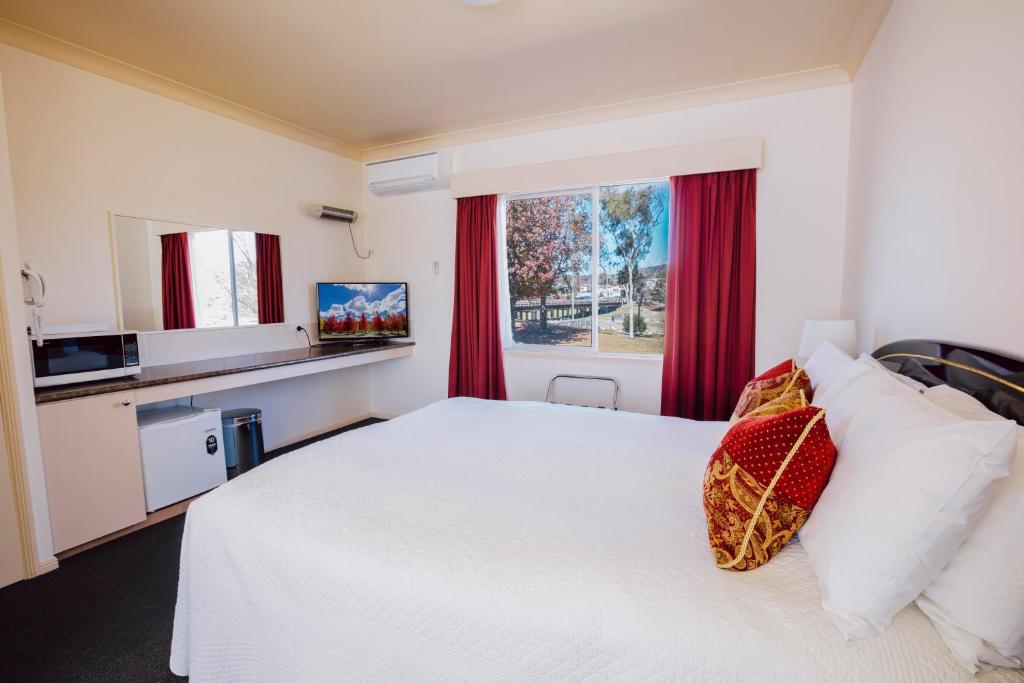 Postel nebo postele na pokoji v ubytování Boulevard Motel