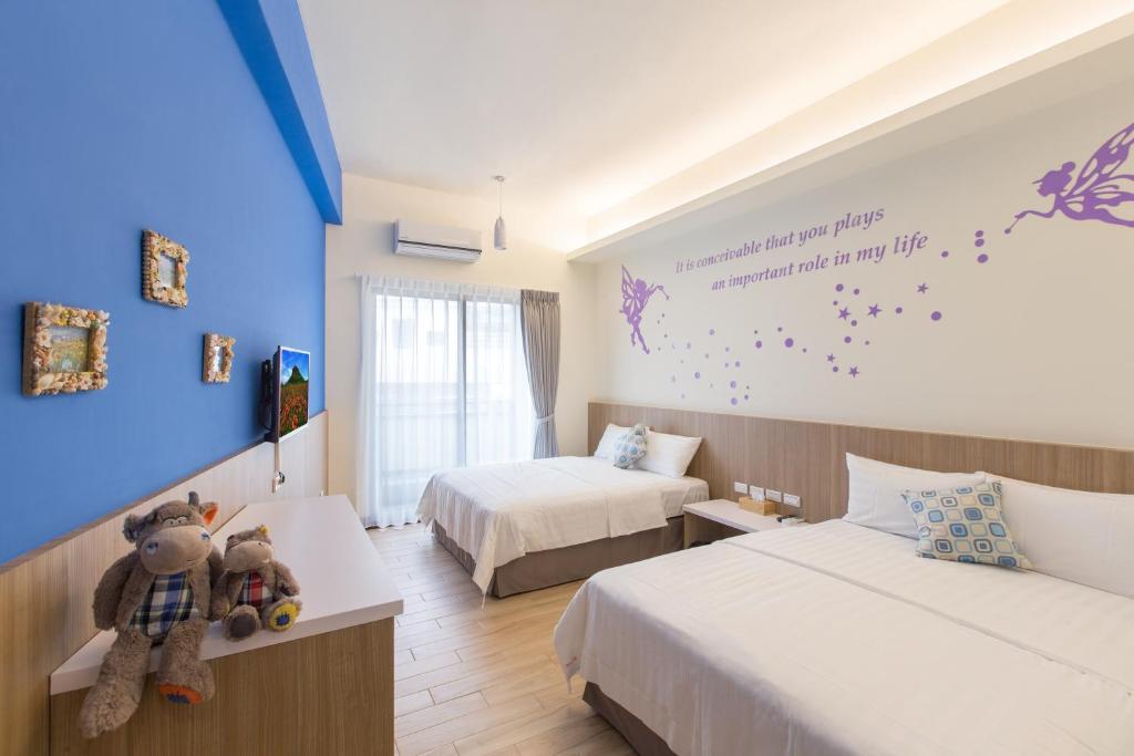 Postel nebo postele na pokoji v ubytování Sanwu Homestay