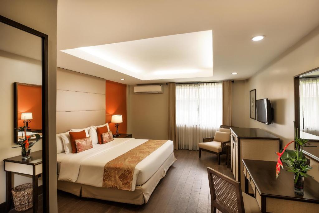 Postel nebo postele na pokoji v ubytování Montebello Villa Hotel