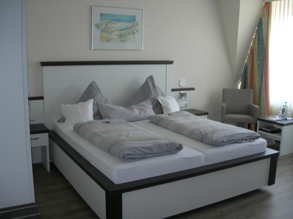 Postel nebo postele na pokoji v ubytování Apart Hotel Norden