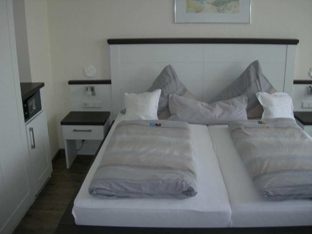 Postel nebo postele na pokoji v ubytování Apart Hotel Norden