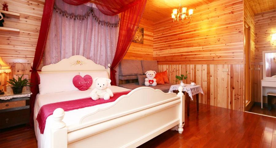 Postel nebo postele na pokoji v ubytování Yilan Homeland B&B